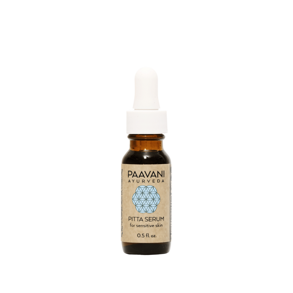 Paavani Ayurveda Pitta Serum, Ayurvedic face oil for sensitive skin, featuring a dropper with light-colored serum in a glass bottle.