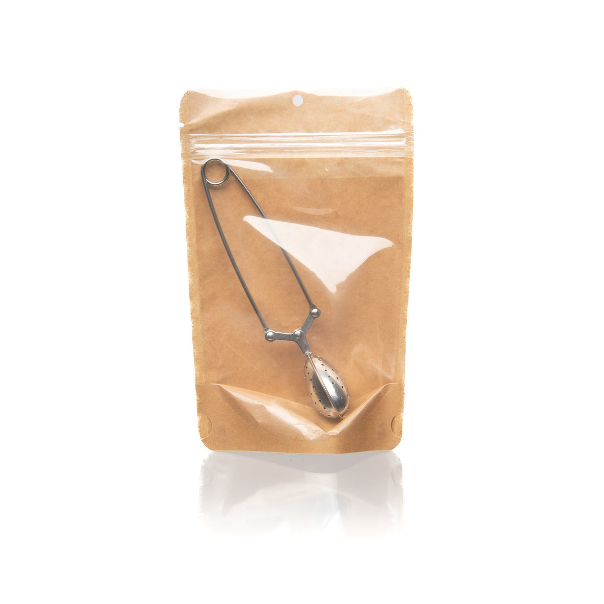 Heart-shaped stainless steel tea infuser with fine mesh strainer for loose-leaf tea, ideal for tea rituals by Paavani Ayurveda.