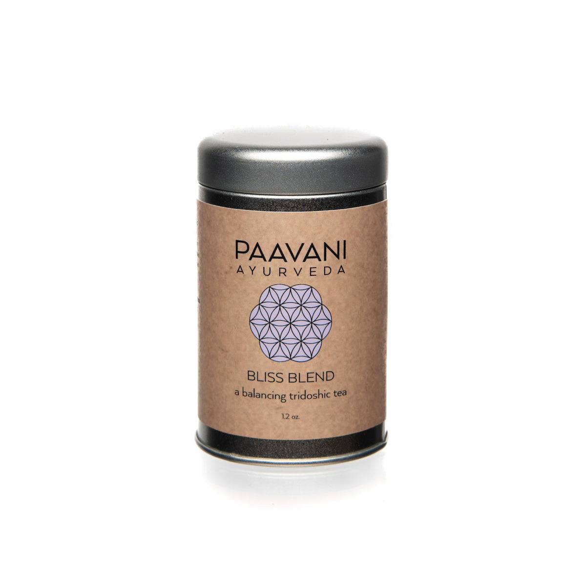 Paavani Ayurveda Bliss Blend Tridoshic tea in a simple white cup with herbal tea leaves on a wooden surface.