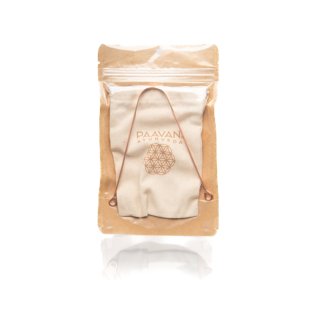 Copper tongue cleaner from Paavani Ayurveda for fresh breath and daily detox, shown with smooth, rounded scraping edges.