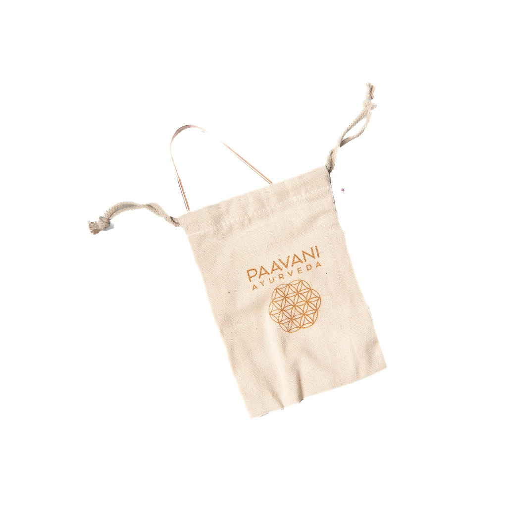 Copper tongue cleaner by Paavani Ayurveda, featuring a simple design for Ayurvedic tongue scraping and fresh breath.