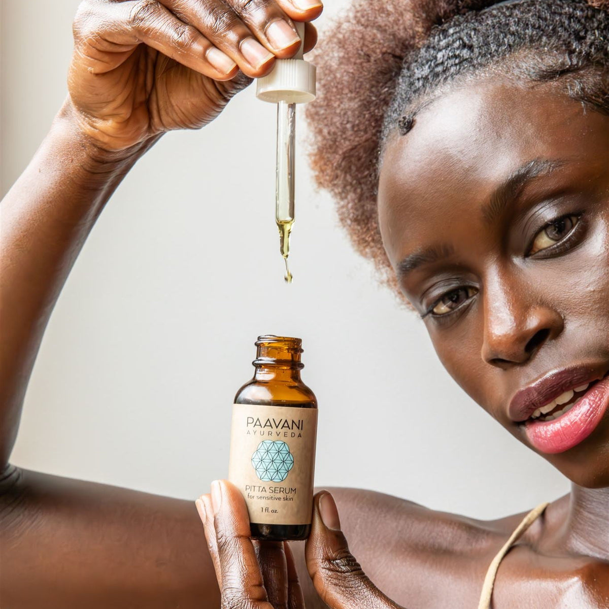 Paavani Ayurveda Pitta Serum, Ayurvedic face oil for sensitive skin, featuring a dropper bottle with light herbal-infused oil.