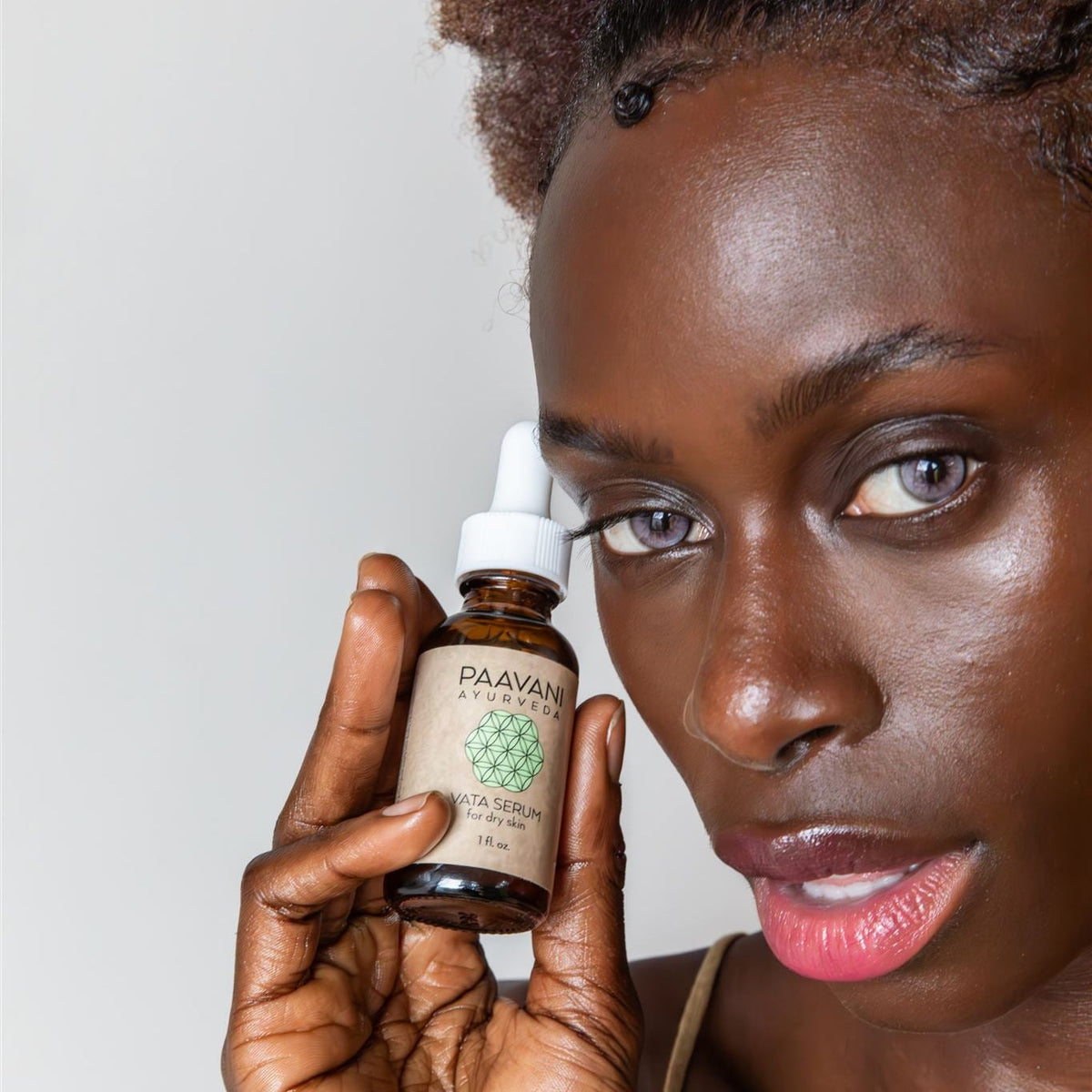 Paavani Ayurveda Vata Serum in a glass bottle, Ayurvedic face oil for dry, delicate skin, with natural ingredients and soothing texture.
