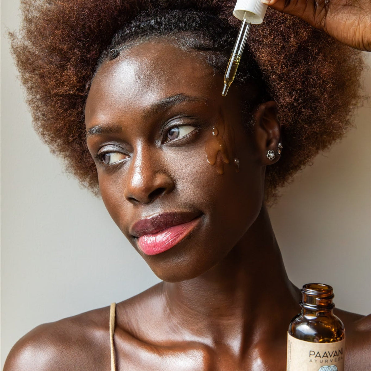 Paavani Ayurveda Clarify Serum in a glass bottle, Ayurvedic face oil for blemish-prone skin, with natural herbal ingredients visible.
