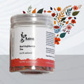 Red goji berry tea by Amu in a clear glass cup, showing vibrant red berries and brewed tea, emphasizing antioxidant-rich Asian elixir.